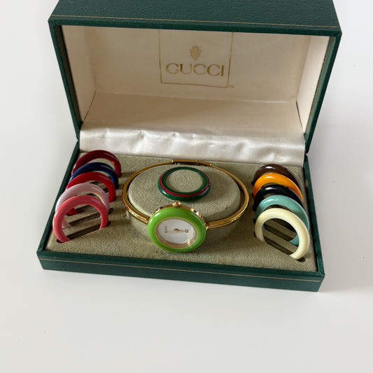 Gucci 1990s Interchangeable Bezel Gold Plated Bangle Watch with 12 bezels, case