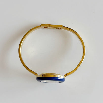 Gucci 1990s Interchangeable Bezel Gold Plated Bangle Watch with 12 bezels, case