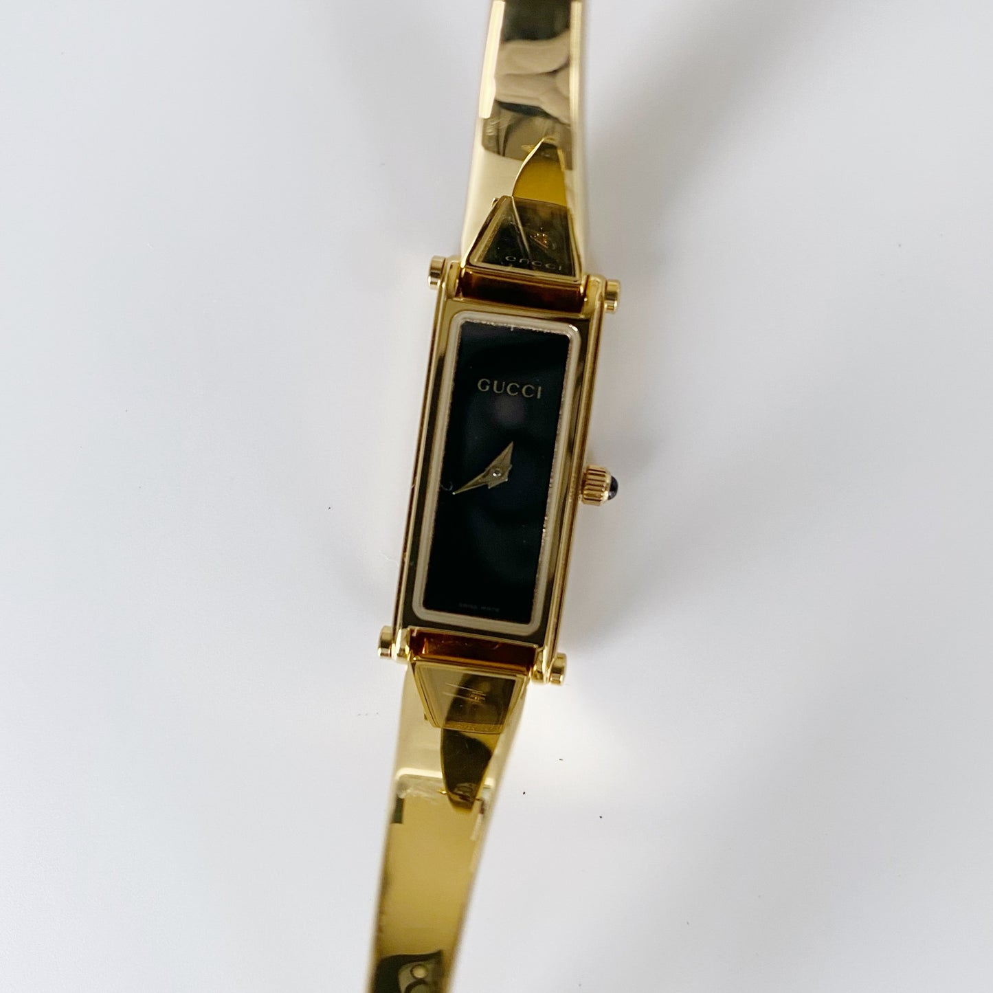 Gucci 1990s Black Dial Rectangular Gold Plated Bangle Watch