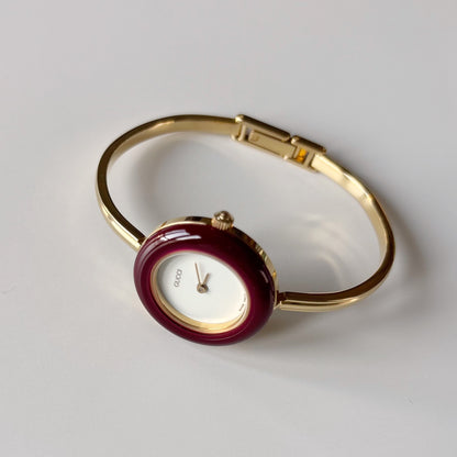 Gucci 1990s Interchangeable Bezel Gold Plated Bangle Watch with 12 bezels, case