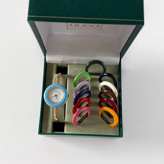 Gucci 1990s Interchangeable Bezel Gold Plated Bangle Watch with 12 bezels, case