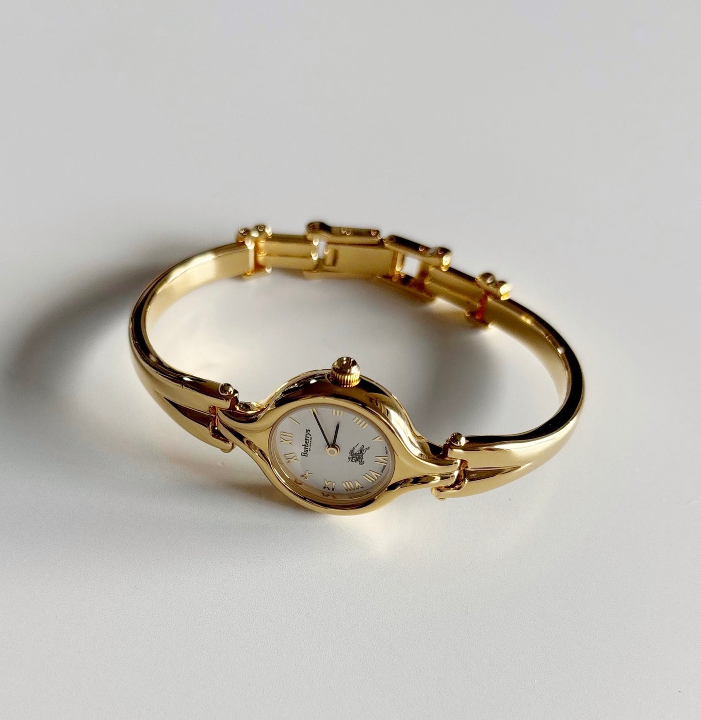 Burberry 1990s Round Dial Gold Plated Bangle Watch