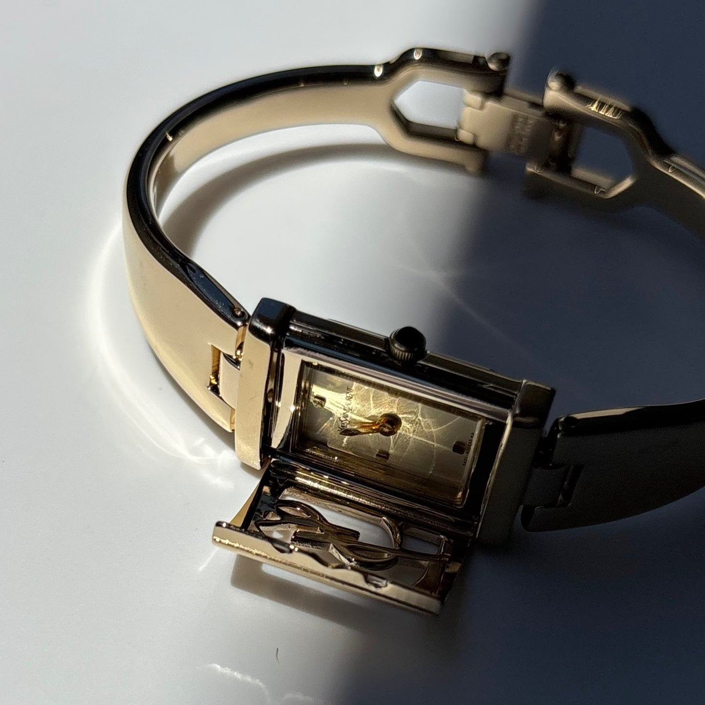 Yves Saint Laurent 1990s Peek-A-Boo Gold Plated Bangle Watch