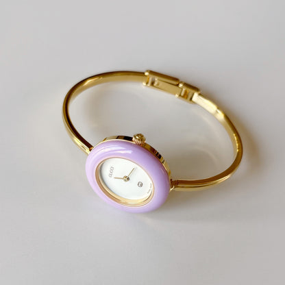 Gucci 1990s Interchangeable Bezel Gold Plated Bangle Watch with 12 bezels, case