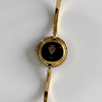 Gucci 1990s Interchangeable Bezel Gold Plated Bangle Watch with 12 bezels, case