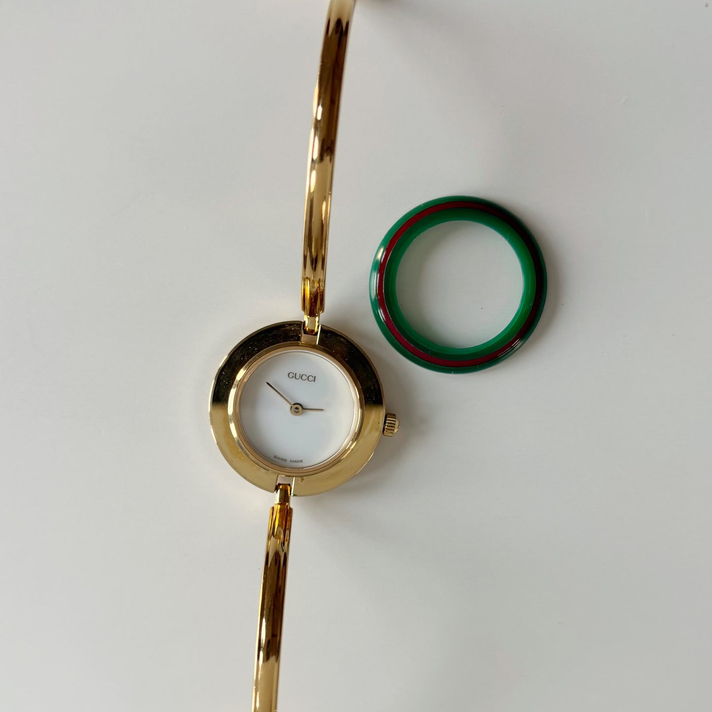 Gucci 1990s Interchangeable Bezel Gold Plated Bangle Watch with 12 bezels, case