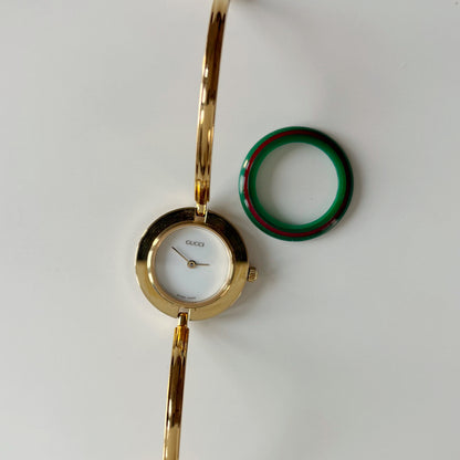Gucci 1990s Interchangeable Bezel Gold Plated Bangle Watch with 12 bezels, case