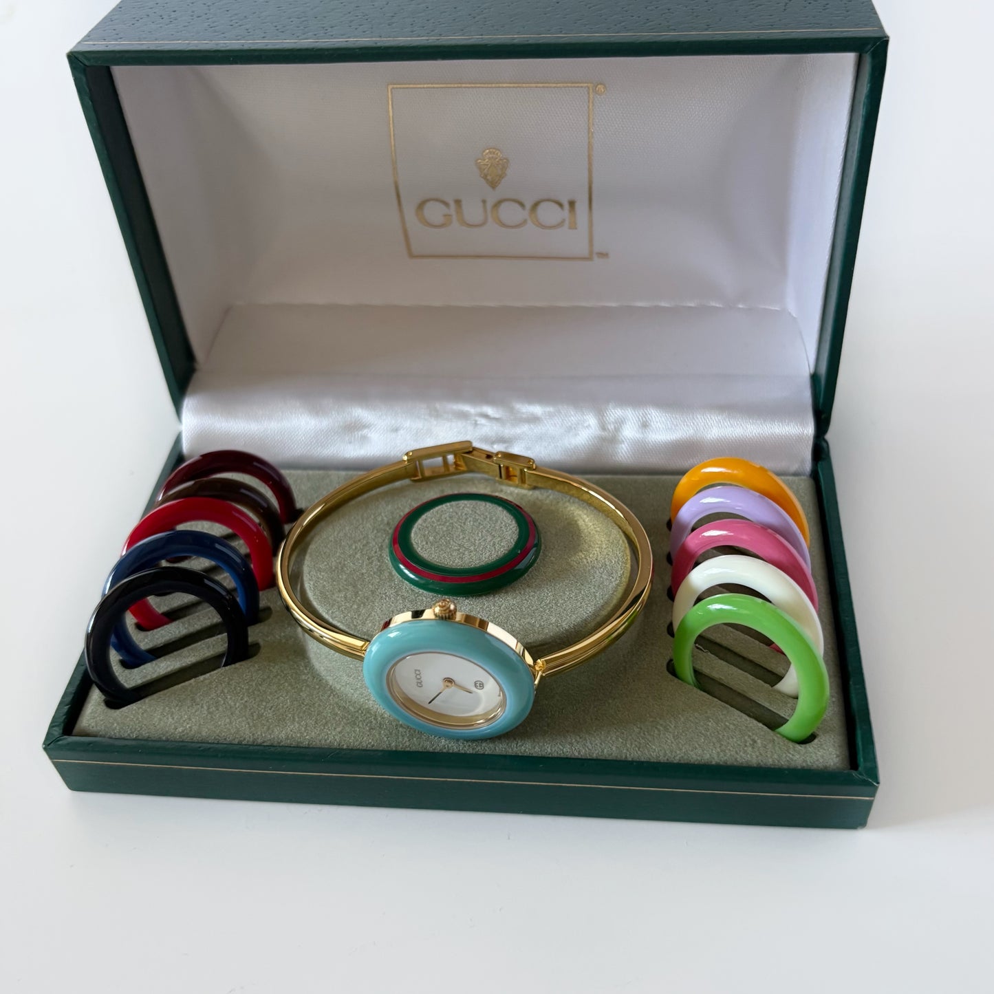 Gucci 1990s Interchangeable Bezel Gold Plated Bangle Watch with 12 bezels, case