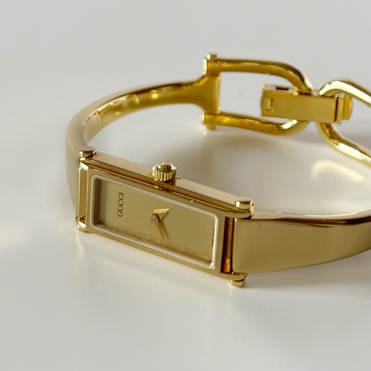 Gucci 1990s Gold Rectangular Dial Gold Plated Bangle Watch