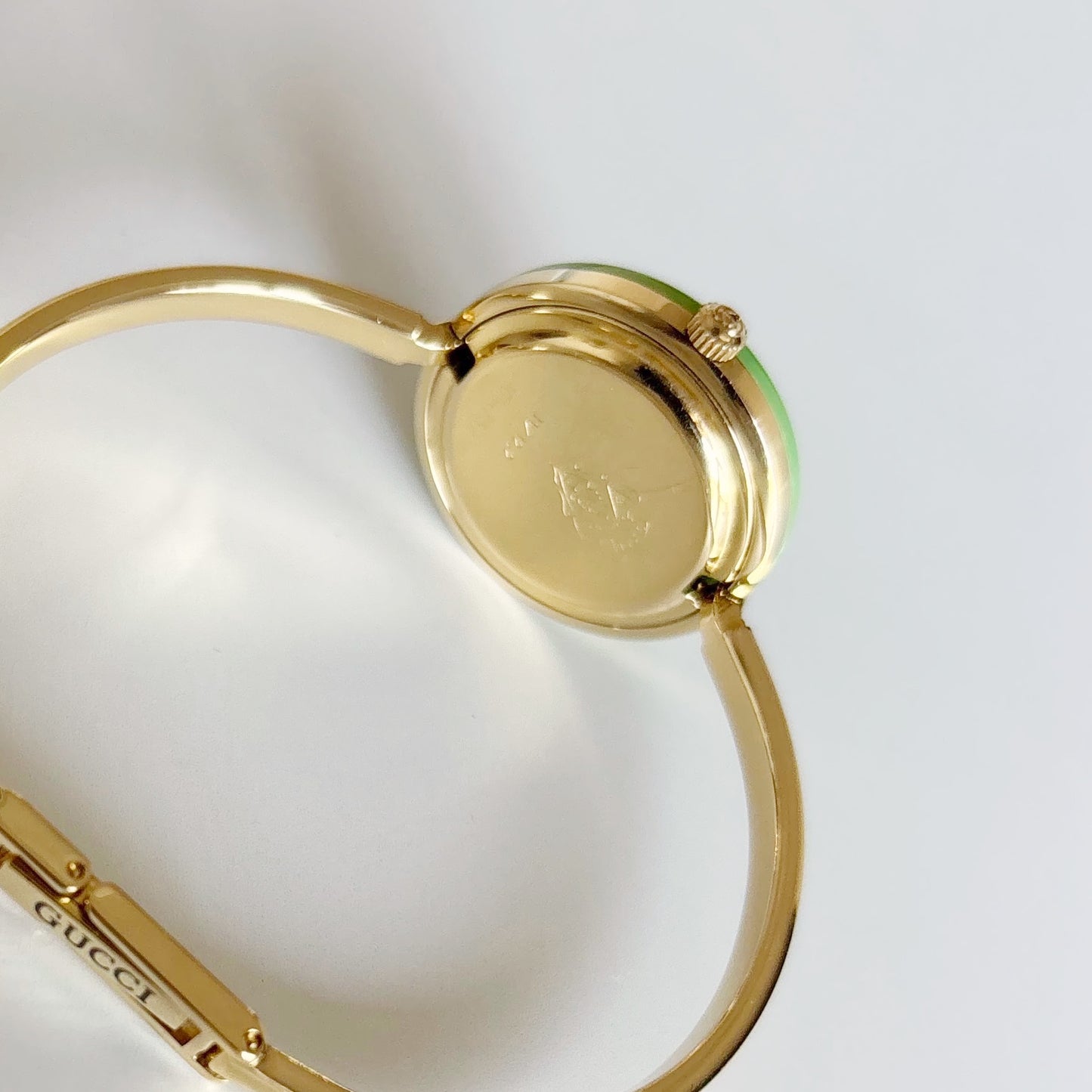 Gucci 1990s Interchangeable Bezel Gold Plated Bangle Watch with 12 bezels, case