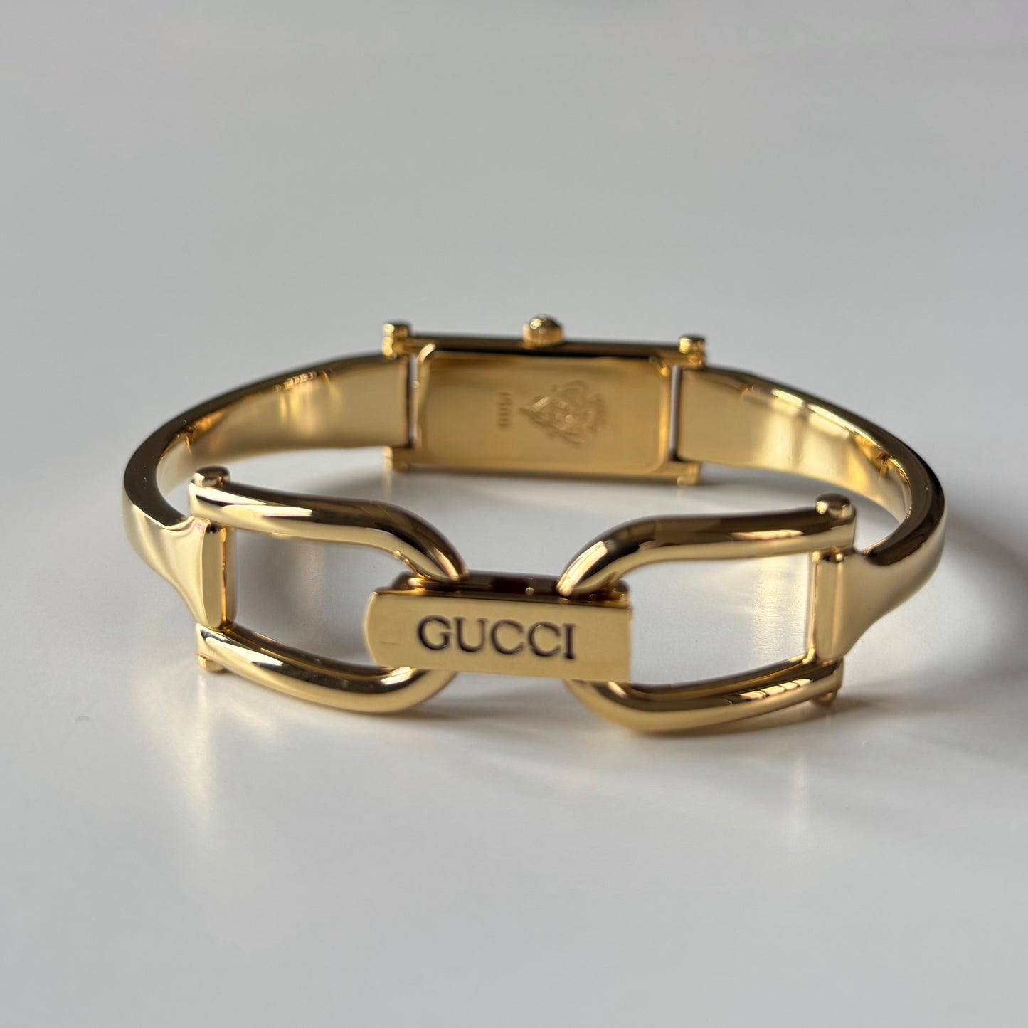 Gucci 1990s Gold Rectangular Dial Gold Plated Bangle Watch