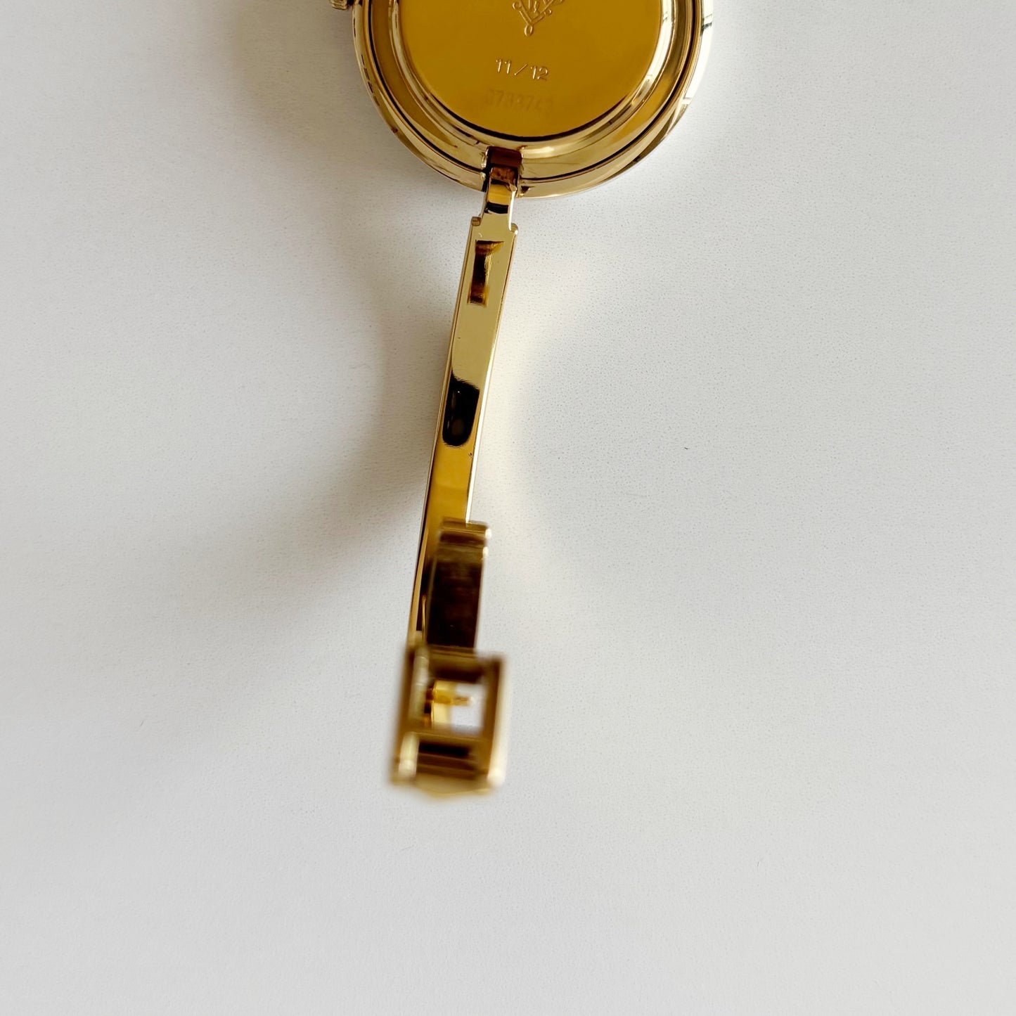 Gucci 1990s Interchangeable Bezel Gold Plated Bangle Watch with 12 bezels, case