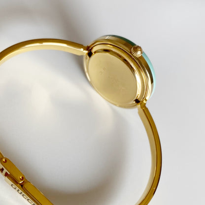 Gucci 1990s Interchangeable Bezel Gold Plated Bangle Watch with 12 bezels, case