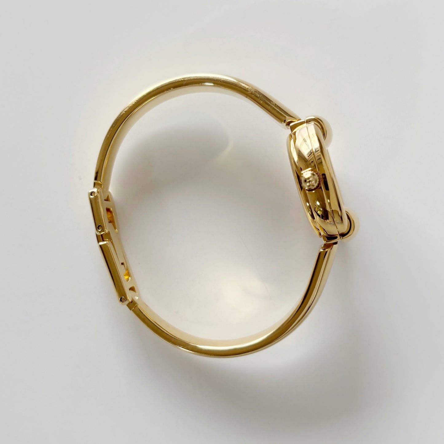 Gucci 1990s Round Dial Gold Plated Bangle Watch (Small)