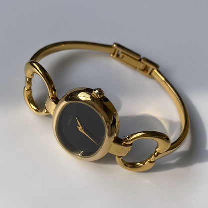 Gucci 1990s Black Dial Gold Plated Bangle Watch