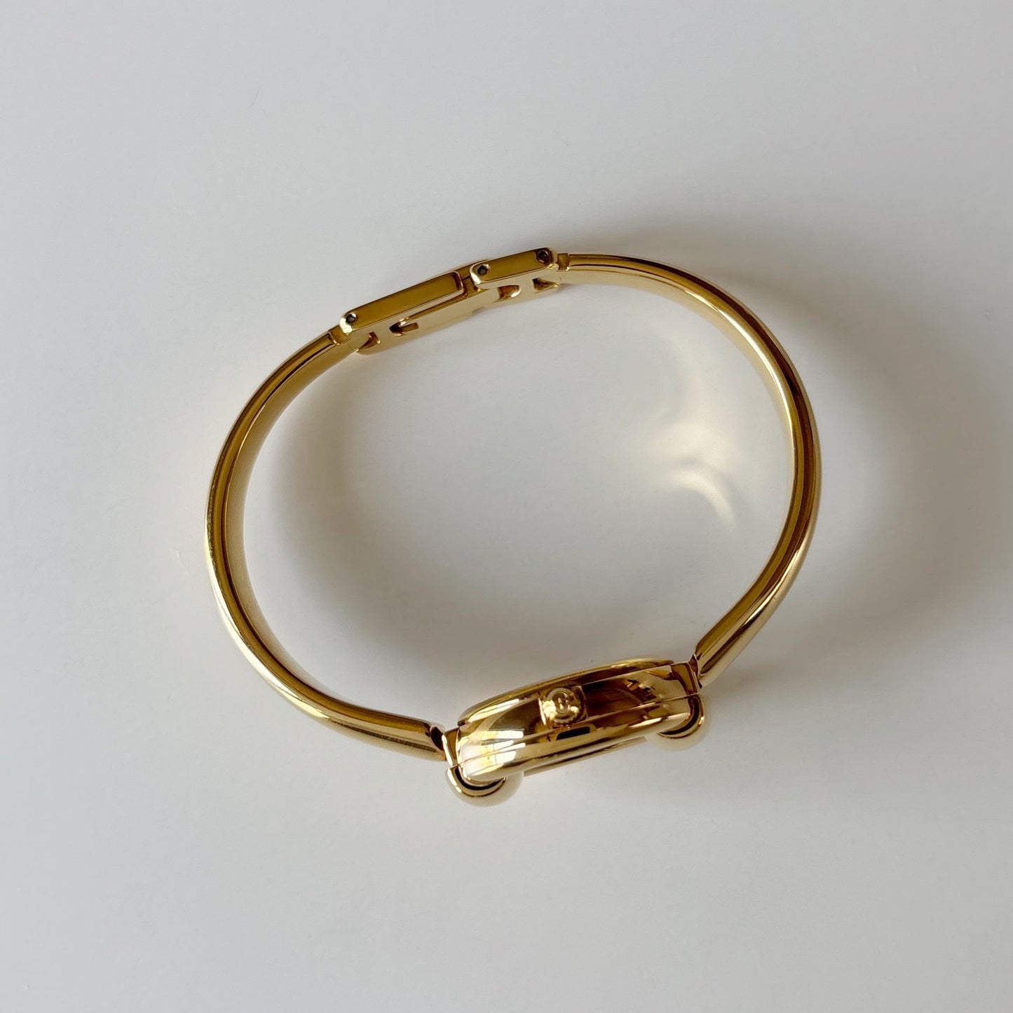 Gucci 1990s Round Dial Gold Plated Bangle Watch
