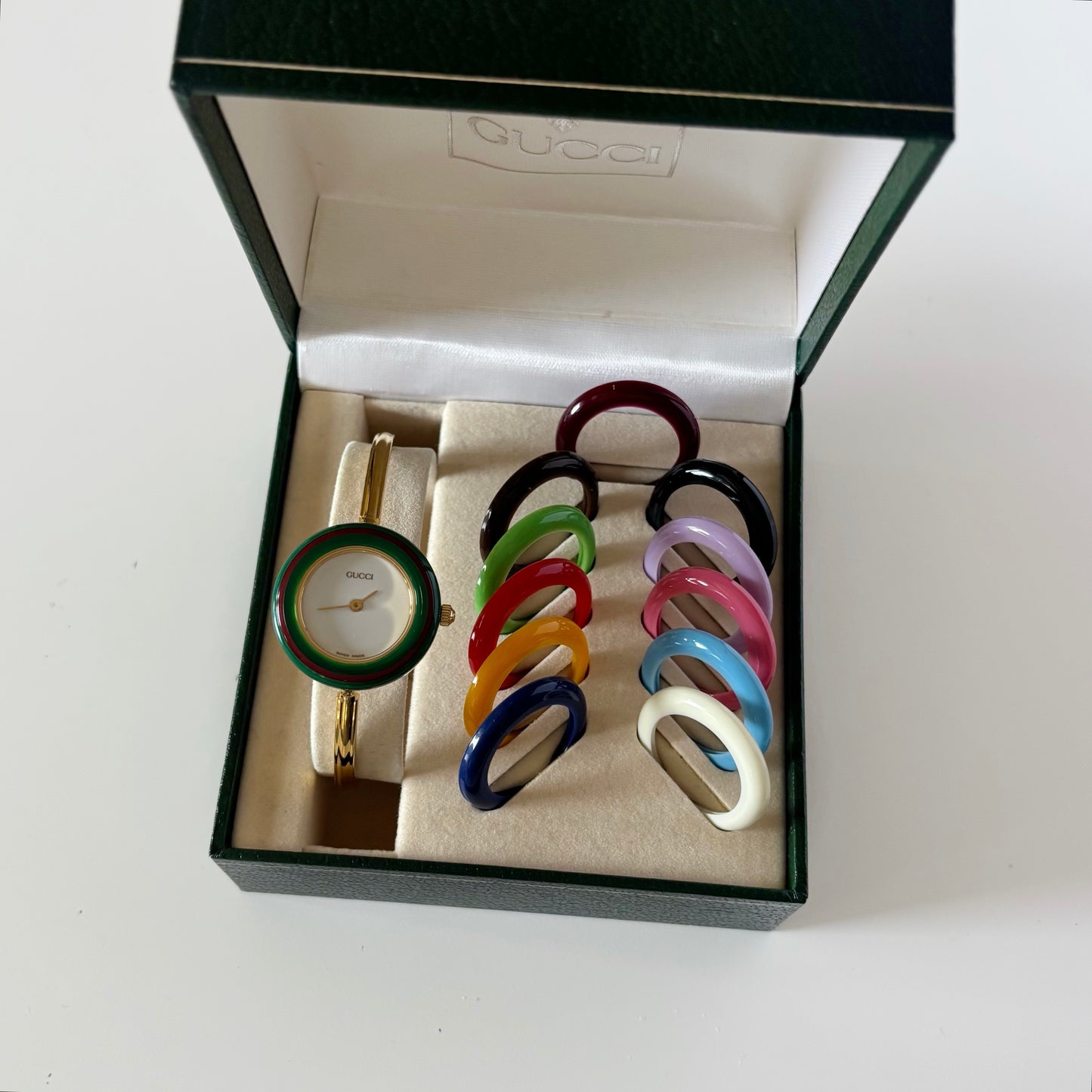 Gucci 1990s Interchangeable Bezel Gold Plated Bangle Watch with 12 bezels, case