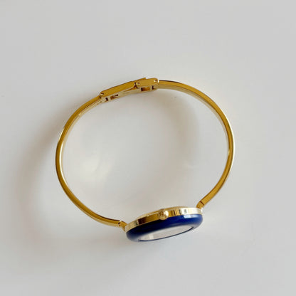 Gucci 1990s Interchangeable Bezel Gold Plated Bangle Watch with 12 bezels, case