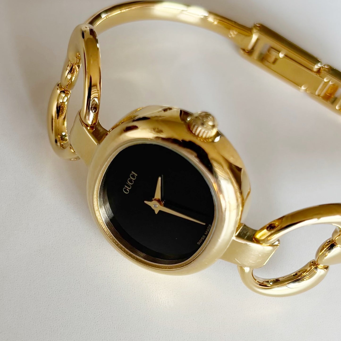 Gucci 1990s Oval Black Dial Gold Plated Bangle Watch (Small)