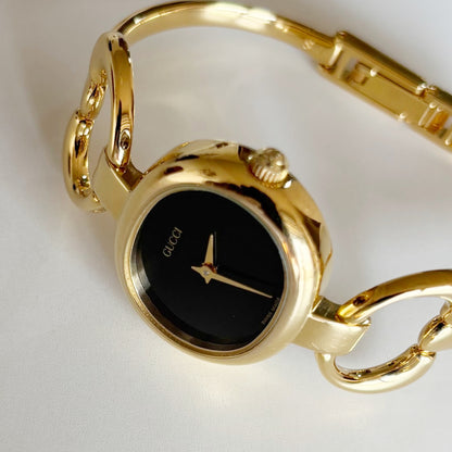 Gucci 1990s Oval Black Dial Gold Plated Bangle Watch (Small)