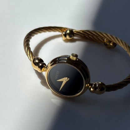 Gucci 1990s Black Round Dial Cable Gold-Plated Bangle Watch