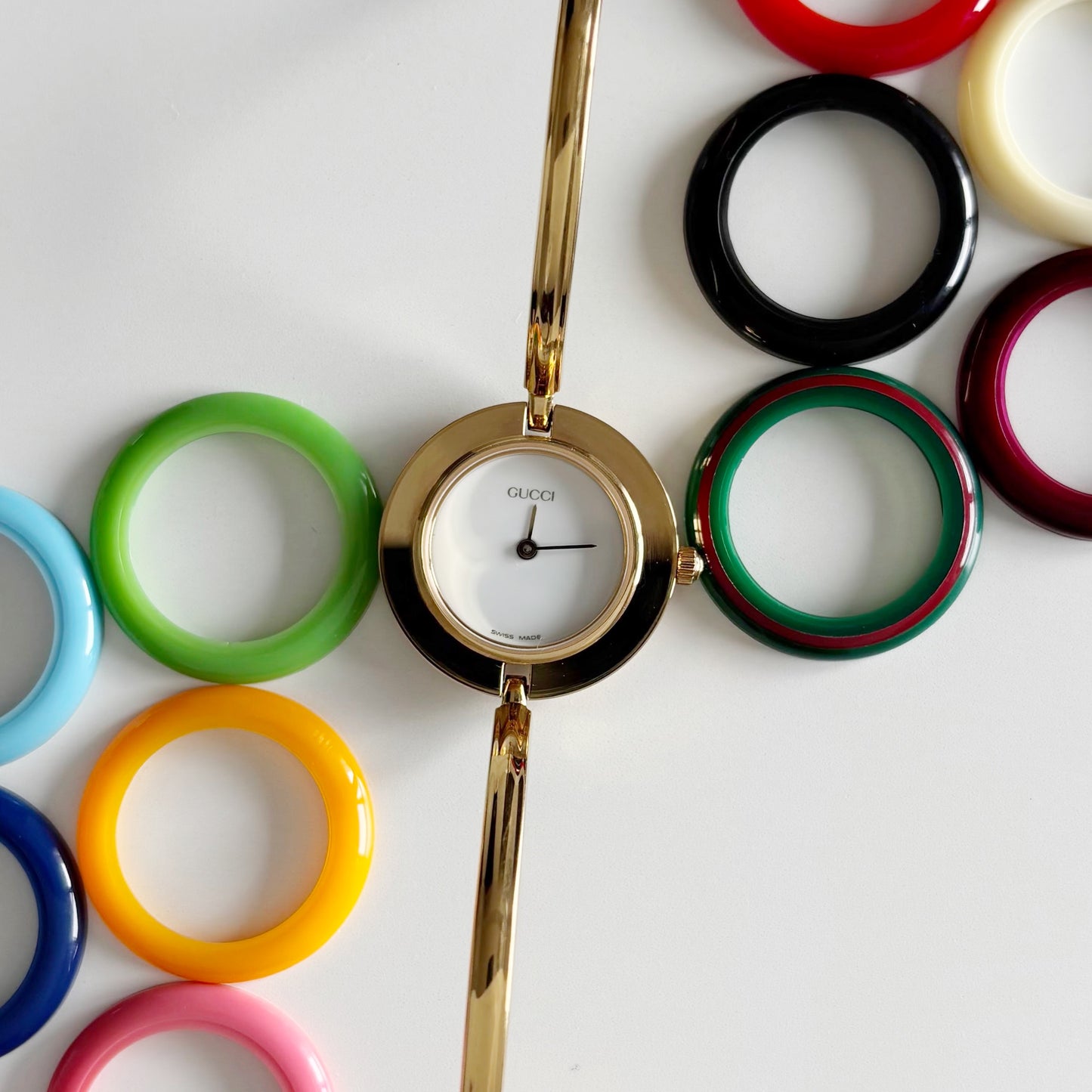 Gucci 1990s Interchangeable Bezel Gold Plated Bangle Watch with 12 bezels, case