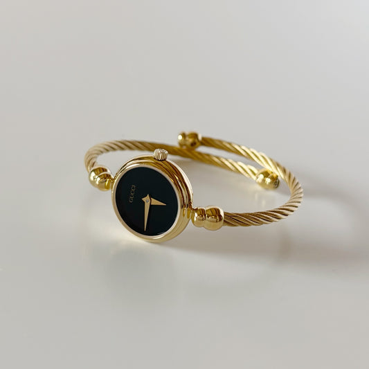Gucci 1990s Black Round Dial Gold-Plated Cable Bangle Watch