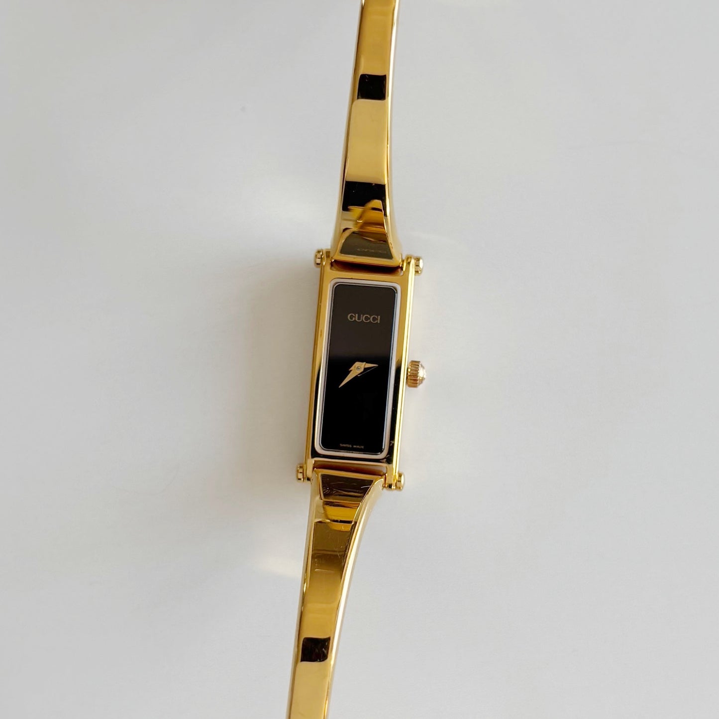 Gucci 1990s Black Rectangular Dial Gold Plated Bangle Watch