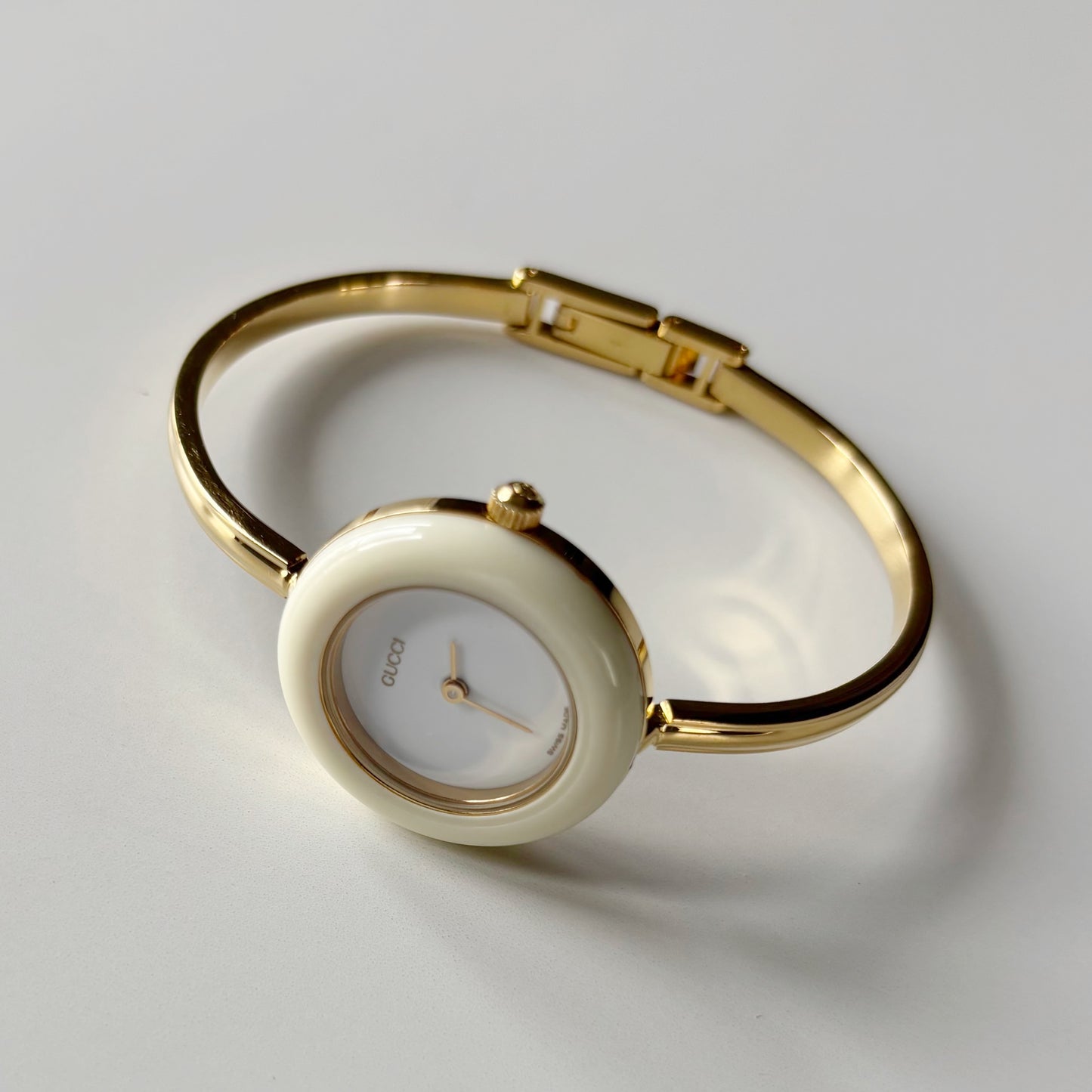 Gucci 1990s Interchangeable Bezel Gold Plated Bangle Watch with 12 bezels, case