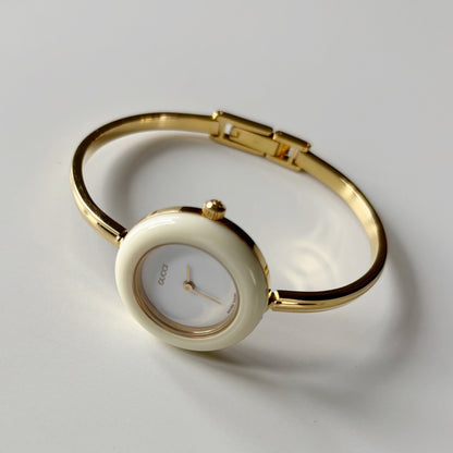 Gucci 1990s Interchangeable Bezel Gold Plated Bangle Watch with 12 bezels, case