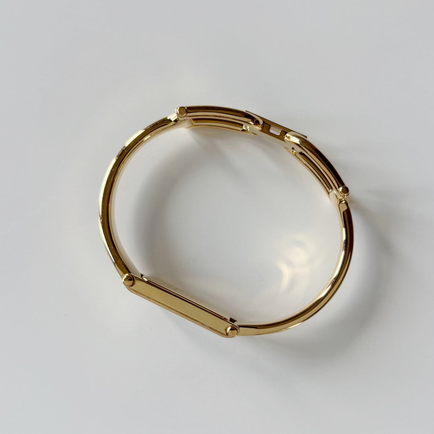 Gucci 1990s Black Rectangular Dial Gold Plated Bangle Watch