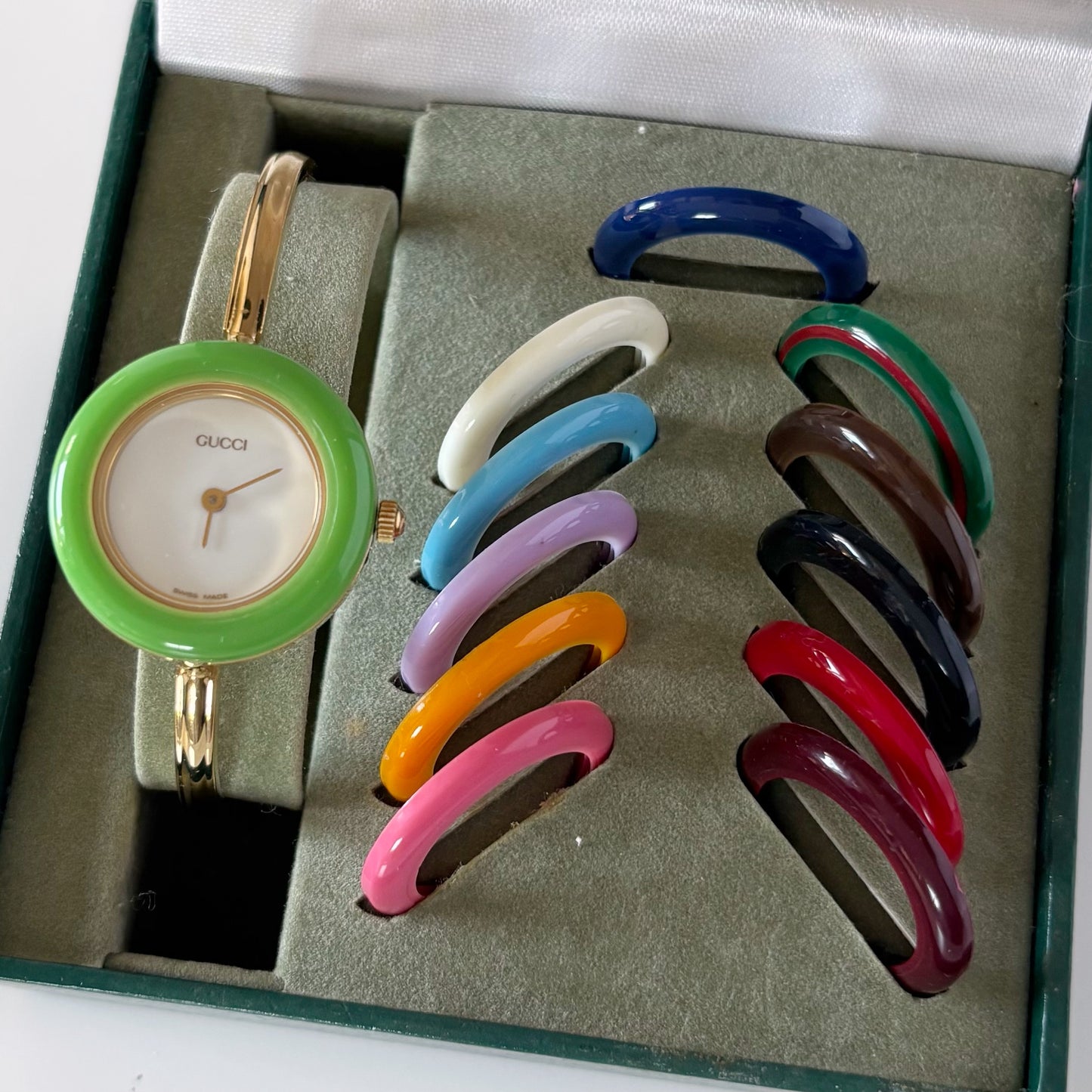 Gucci 1990s Interchangeable Bezel Gold Plated Bangle Watch with 12 bezels, case