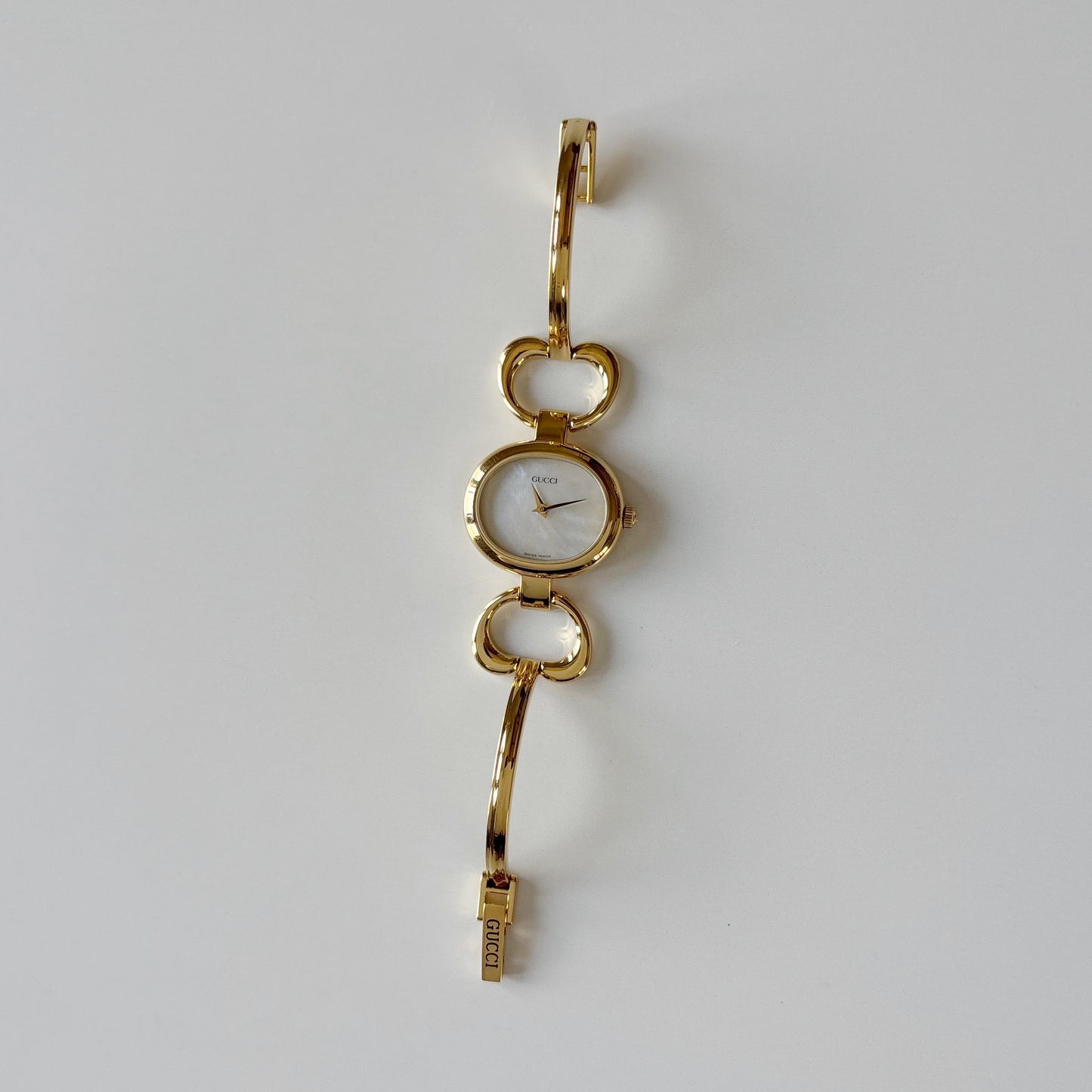 Gucci 1990s Seashell Oval Dial Gold Plated Bangle Watch (Small)