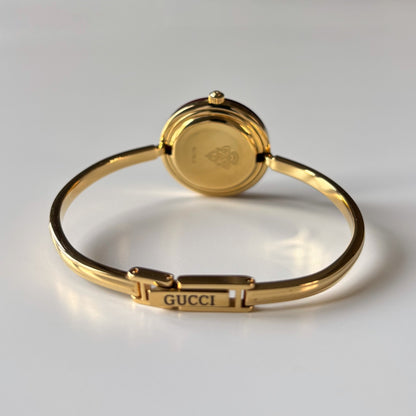 Gucci 1990s Interchangeable Bezel Gold Plated Bangle Watch with 12 bezels, case
