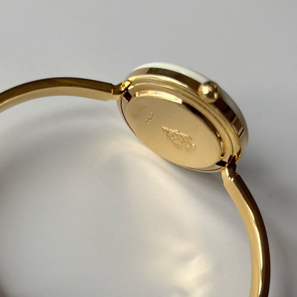 Gucci 1990s Interchangeable Bezel Gold Plated Bangle Watch with 12 bezels, case