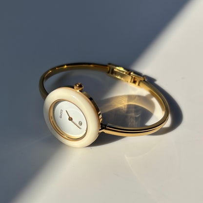 Gucci 1990s Interchangeable Bezel Gold Plated Bangle Watch with 12 bezels, case