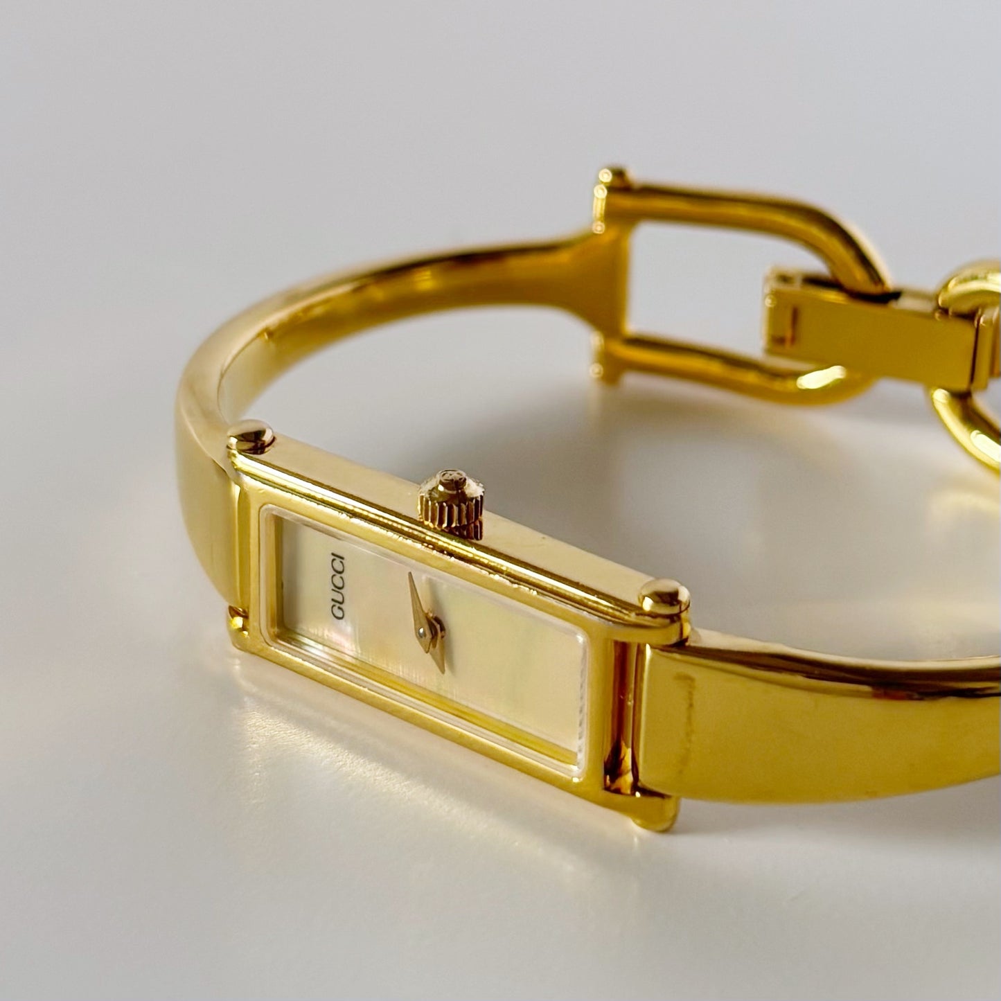 Gucci 1990s Rectangular Seashell Dial Gold Plated Bangle Watch