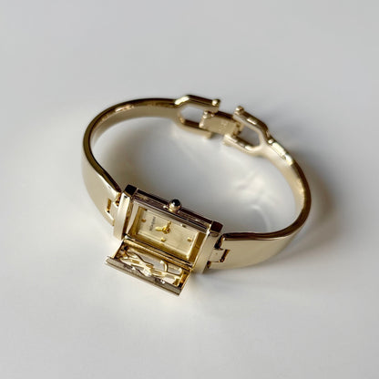 Yves Saint Laurent 1990s Peek-A-Boo Gold Plated Bangle Watch