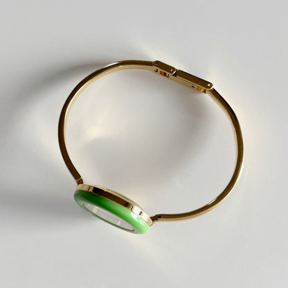 Gucci 1990s Interchangeable Bezel Gold Plated Bangle Watch with 12 bezels, case