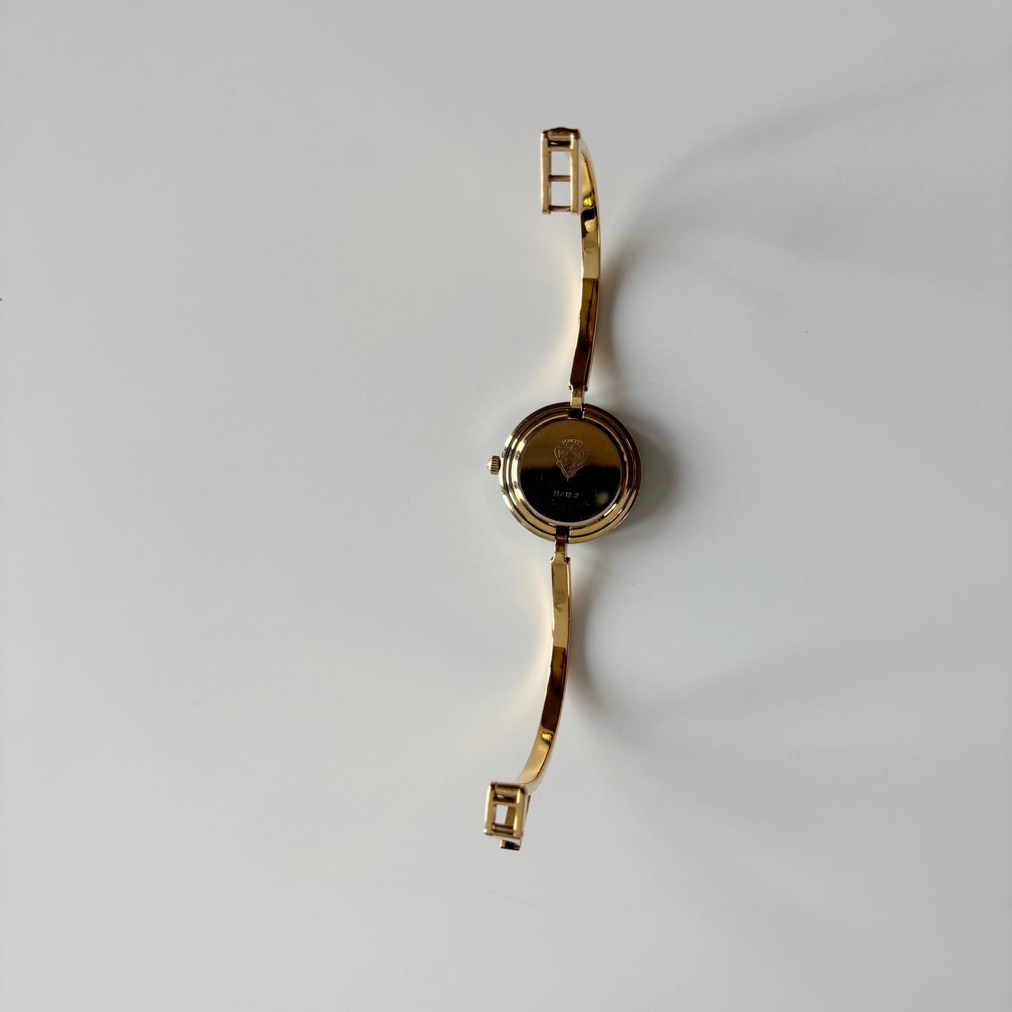 Gucci 1990s Interchangeable Bezel Gold Plated Bangle Watch with 12 bezels, case