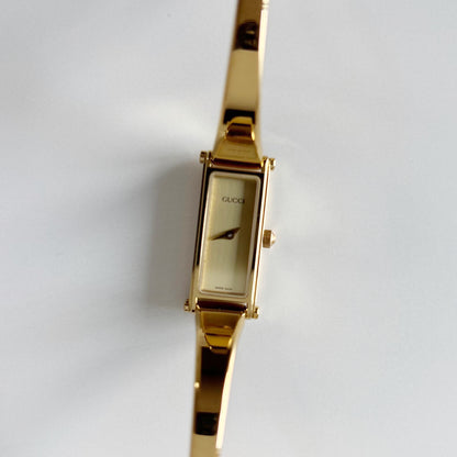 Gucci 1990s Gold Dial Rectangular Gold Plated Bangle Watch