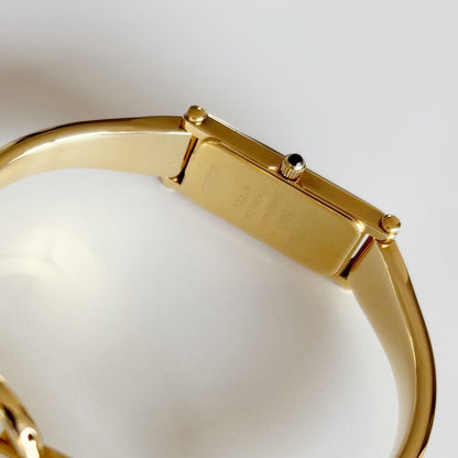Gucci 1990s Rectangular Gold Dial Gold Plated Bangle Watch