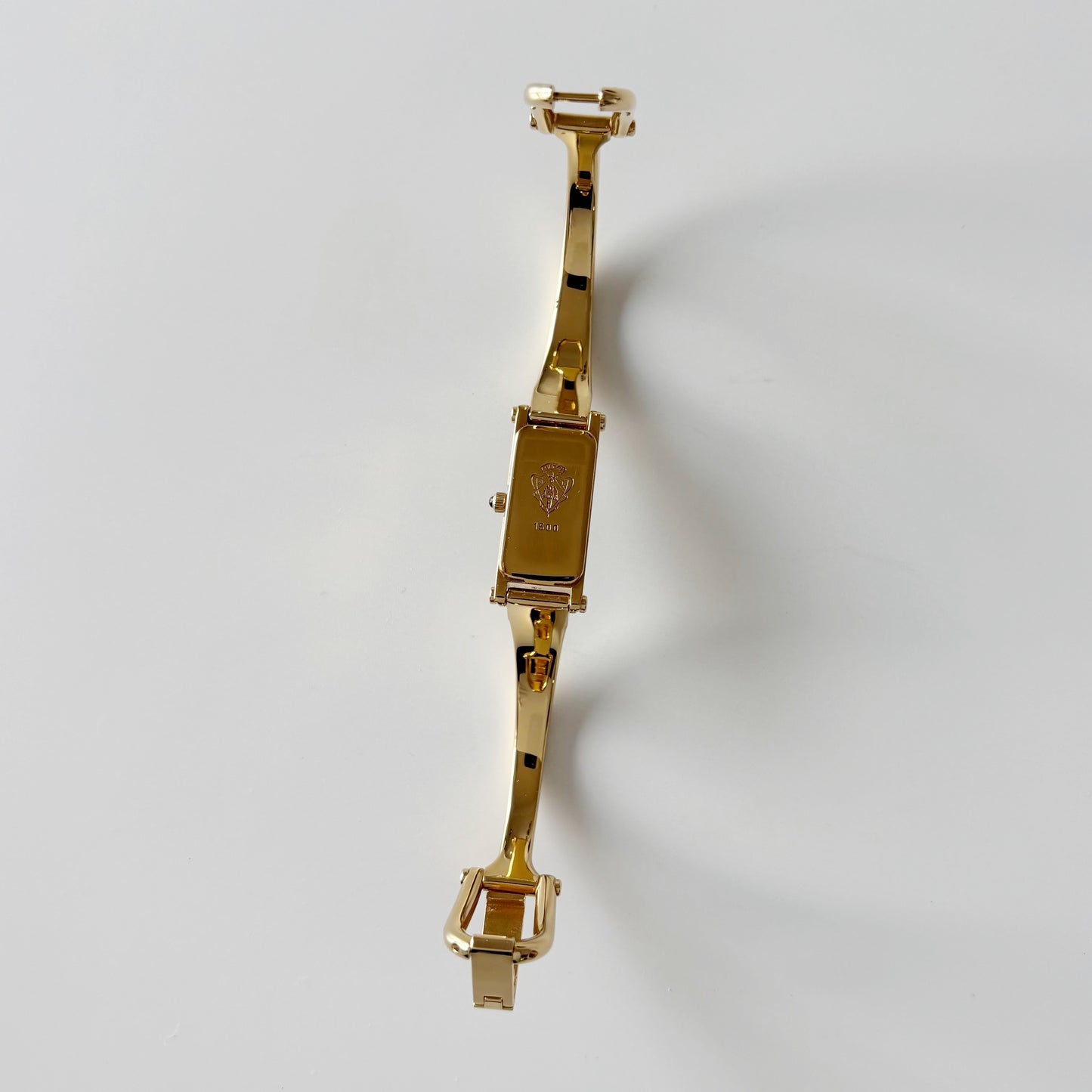 Gucci 1990s Rectangular Black Dial Gold Plated Bangle Watch