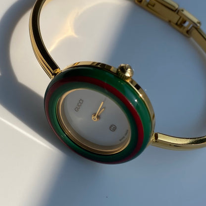 Gucci 1990s Interchangeable Bezel Gold Plated Bangle Watch with 12 bezels, case