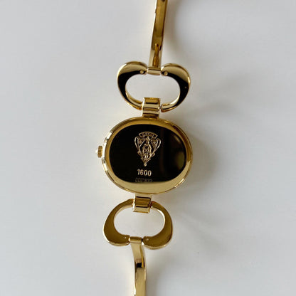 Gucci 1990s Seashell Oval Dial Gold Plated Bangle Watch (Small)