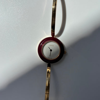 Gucci 1990s Interchangeable Bezel Gold Plated Bangle Watch with 12 bezels, case
