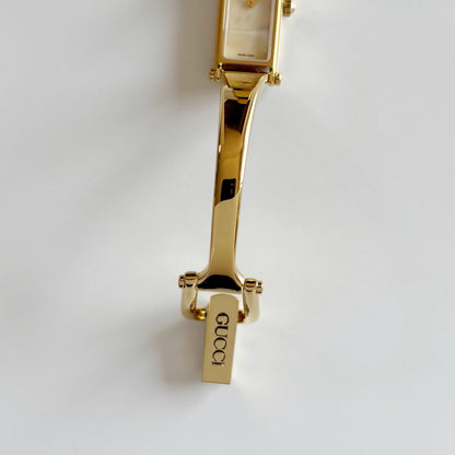 Gucci 1990s Seashell Rectangular Dial Gold Plated Bangle Watch