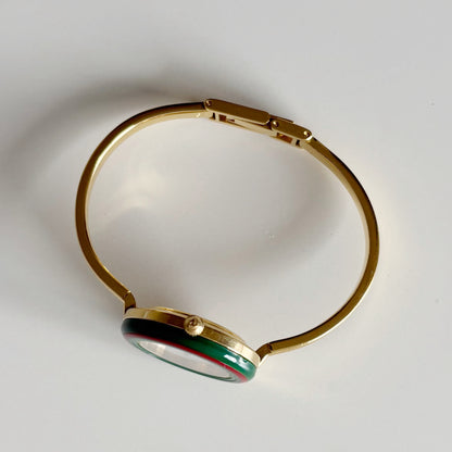 Gucci 1990s Interchangeable Bezel Gold Plated Bangle Watch with 12 bezels, case (Small)