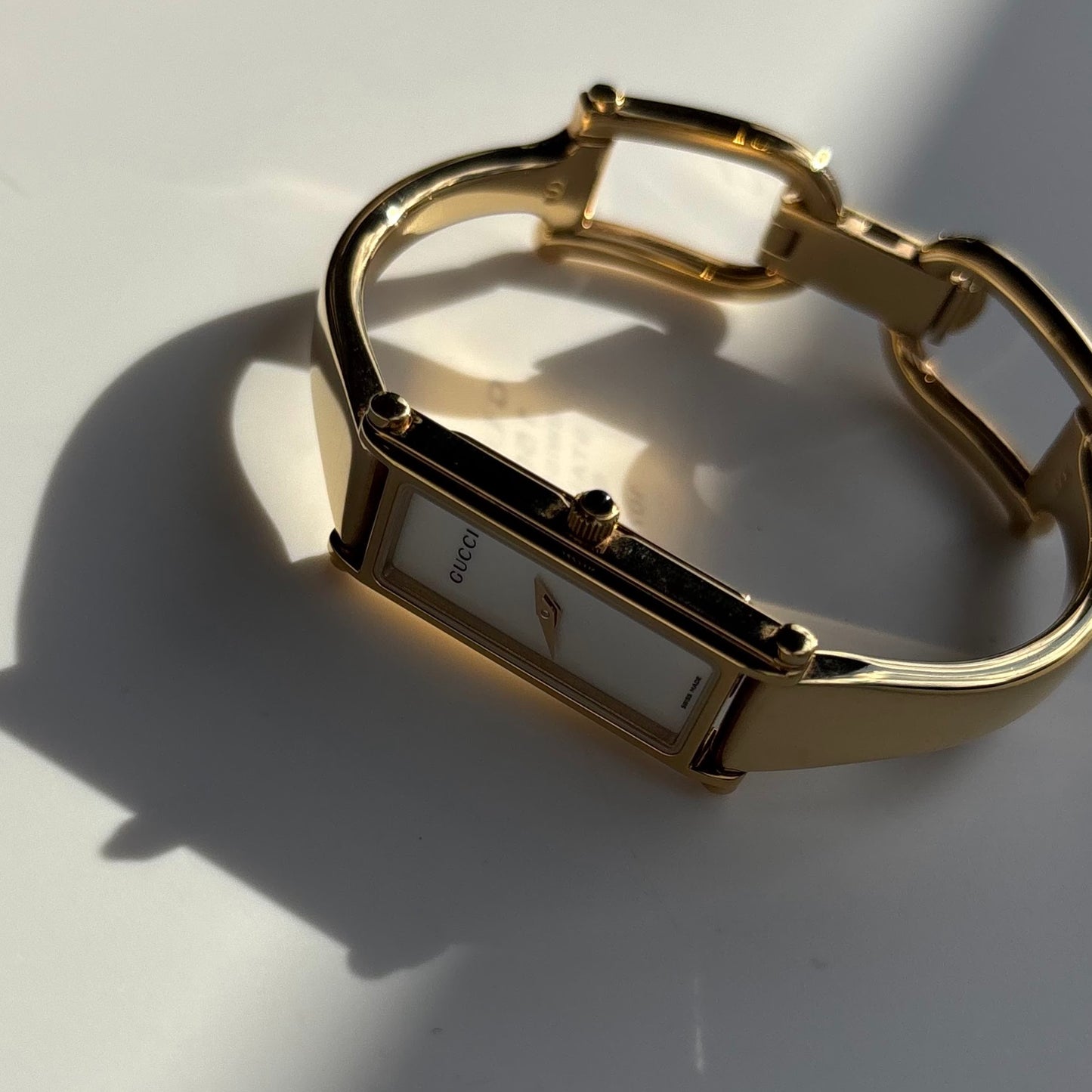 Gucci 1990s Seashell Rectangular Dial Gold Plated Bangle Watch (Small)