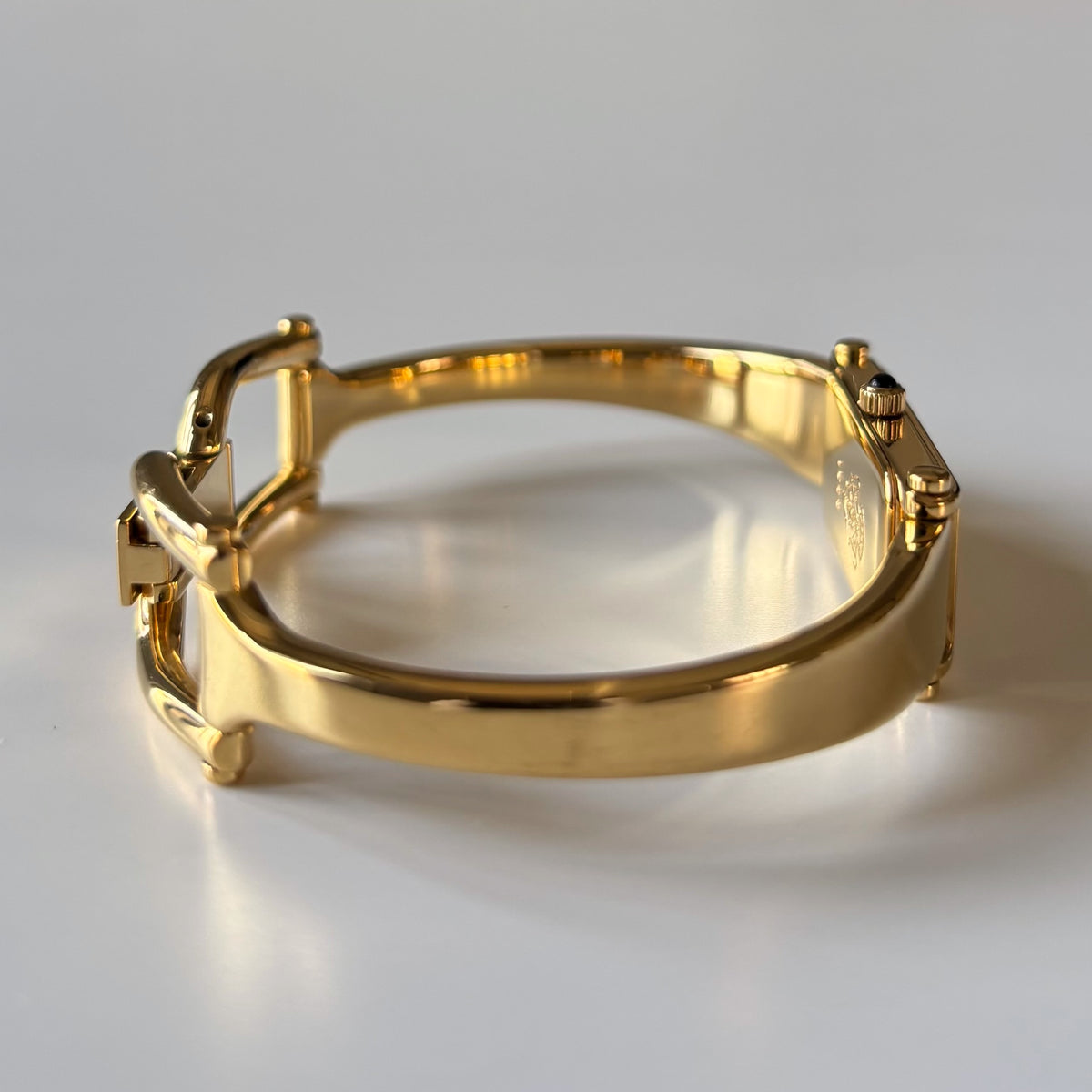 Gucci 1990s Rectangular Gold Dial Gold Plated Bangle Watch